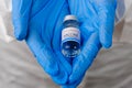 Moderna vaccine for prevention of coronavirus, Covid-19, Sars-Cov-2 in doctors hands in rubber blue gloves, January 2021