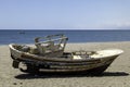 old wooden worn fishing boats abandoned on the beach of Cabo de Gata, Almeria, Spain.