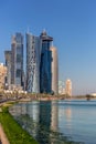 Moderns buildings under construction in downtown Doha in a blue sky day in Qatar.