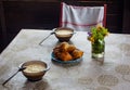 Modest breakfast in a country house. On the table are plates of porridge, pies Royalty Free Stock Photo