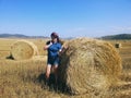 Modest young woman in hayfield Royalty Free Stock Photo