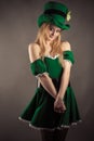 Modest girl in green dress in image leprechaun