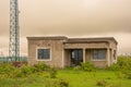 Modest house with telecommunication tower near a Swazi village Royalty Free Stock Photo