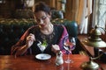 Modest woman in a cafe. Royalty Free Stock Photo