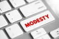Modesty - the quality or state of being unassuming in the estimation of one\'s abilities, text concept button on keyboard