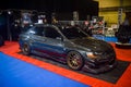 Modified black Mitsubishi Lancer Evolution VIII sedan on display at Indonesia Modification Expo 2023