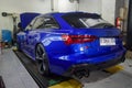 Modified blue Audi RS6 avant in car workshop