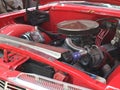 Modified engine in classic antique red Chevrolet car 1959 era on show