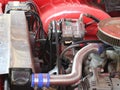 Modified engine in classic antique red Chevrolet car 1959 era on show