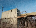 Modified shipping containers used as a security and guard post an an industrial installation. Royalty Free Stock Photo