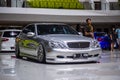 Modified silver Mercedes Benz S 320 in car show
