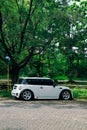 modified white Mini Cooper S parked under the tree on outdoor car meet Royalty Free Stock Photo