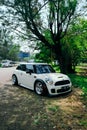 modified white Mini Cooper S parked under the tree on outdoor car meet Royalty Free Stock Photo