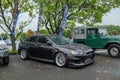 Modified black Mitsubishi Lancer Evolution X on JDM fest parking lot