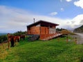 Modular wooden house in a natural environment and extreme landscape of Tierra del Fuego. Panoramic view of rural setting with