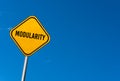 Modularity - yellow sign with blue sky Royalty Free Stock Photo