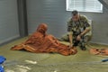 MOE instructor shows how to handle the rescue inflatable raft