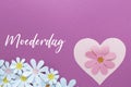 Moederdag the Dutch word for Mothers Day on stacked paper hearts