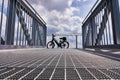 Bicycle leans against the front part of the railing of the viewing platform made of steel gratings