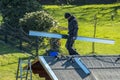 Moers , Germany - February 05 2018 : Roofer balancing on roof with metal facing