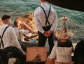 Moet et Chandon champagnes promotion on interior of luxury open-air restaurant on Adriatic sea coast. Waiters are men in