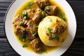 Mofongo made of plantain and chicharron served with meat and broth close-up on a plate. horizontal top view Royalty Free Stock Photo