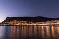 Mogan beach during sunset with the city lit up by street lights and freshly lit streets of the grand canary island valley Royalty Free Stock Photo