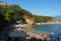 Mogren Beach, Budva, Montenegro, 8.15.22 Beach holiday in summer. Happy tourists relax, sunbathe, swim in the sea waves