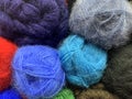Mohair yarn of different colors. Background of skeins stacked by a vertical wall. Royalty Free Stock Photo