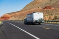 Mohave desert by Route 66. RV Camping, Camper Van on road. Caravan or recreational vehicle motor home trailer on a