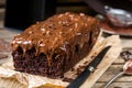 Moist chocolate cake with milk chocolate topping glaze Royalty Free Stock Photo