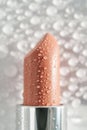 Moisturizing lipstick with water drops on it. Royalty Free Stock Photo