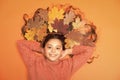 Moisturizing mask. Haircare tips add to fall routine. Little girl small child gorgeous long hair and fallen maple leaves