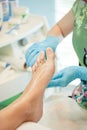 Moisturizing and massage feet pedicure procedure Royalty Free Stock Photo