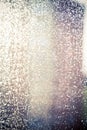 Wet Window glass after heavy rain lit by the setting sun. Abstract blurred background, Selective soft focus Royalty Free Stock Photo