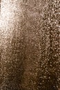 Moisty wet window with water running down the surface. Glass after heavy rain lit by setting sun. Selective soft focus Royalty Free Stock Photo