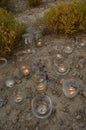 Night light candles burning in upcycled glass jars in desert