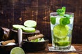 Mojito cocktail at the bar. Mojito cocktail over rustic wood. Cold Mojito, rum, lime and mint tourist drink Royalty Free Stock Photo