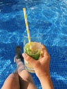 Mojito cocktail on blue pool background Royalty Free Stock Photo
