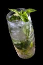 Mojito cocktail in a decorative glass on a dark background