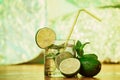 Mojito cocktail with fresh lime on wood table Royalty Free Stock Photo