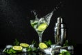 Mojito cocktail with lime and mint in glass on a black reflective background. drink in freeze motion, drops in liquid splash. Royalty Free Stock Photo