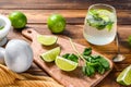 Mojito cocktail making. Ingredients Mint, lime, ice and bar utensils. Wooden background. Top view Royalty Free Stock Photo