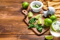 Mojito cocktail making. Ingredients Mint, lime, ice and bar utensils. Wooden background. Top view. Copy space Royalty Free Stock Photo