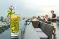 Mojito cocktail on table in rooftop bar Royalty Free Stock Photo