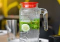 Mojito drink in steamed glass jug, lime, mint Royalty Free Stock Photo