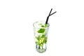 Mojito with lime and mint in a glass cup with a straw on an isolated white background Royalty Free Stock Photo