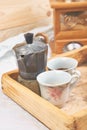 Moka coffee pot with two cup of coffe on wooden tray Royalty Free Stock Photo