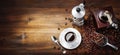 Moka with espresso cup, coffee beans, scoop and grinder in vintage setting. Top view, space for text Royalty Free Stock Photo