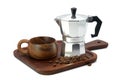 Moka Pot coffee maker with cup wooden and coffee beans on wooden tray Royalty Free Stock Photo